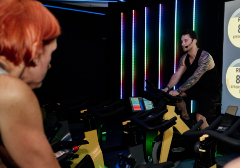 People riding exercise bikes in Spin studio
