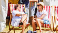 Two women sitting in deckchairs chatting preview