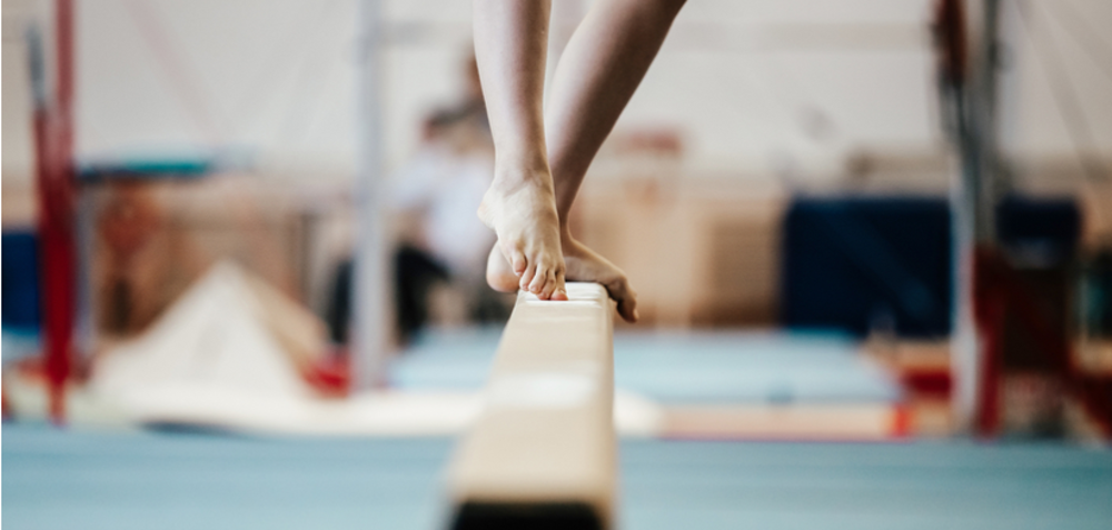 Gymnast balancing on the beam