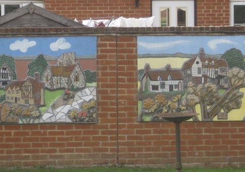 Mosaic of rural houses installed on a wall