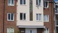Ceramic panel embedded into the front of a three-storey block of flats preview