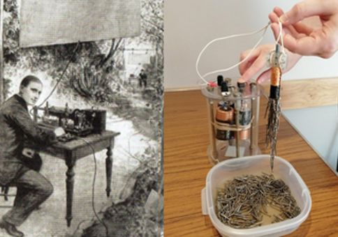 Historic figure next to electrical device and magnet with paperclips