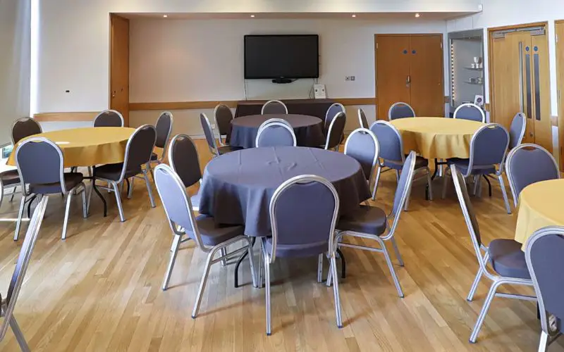 The Wells Suite set up with round tables.