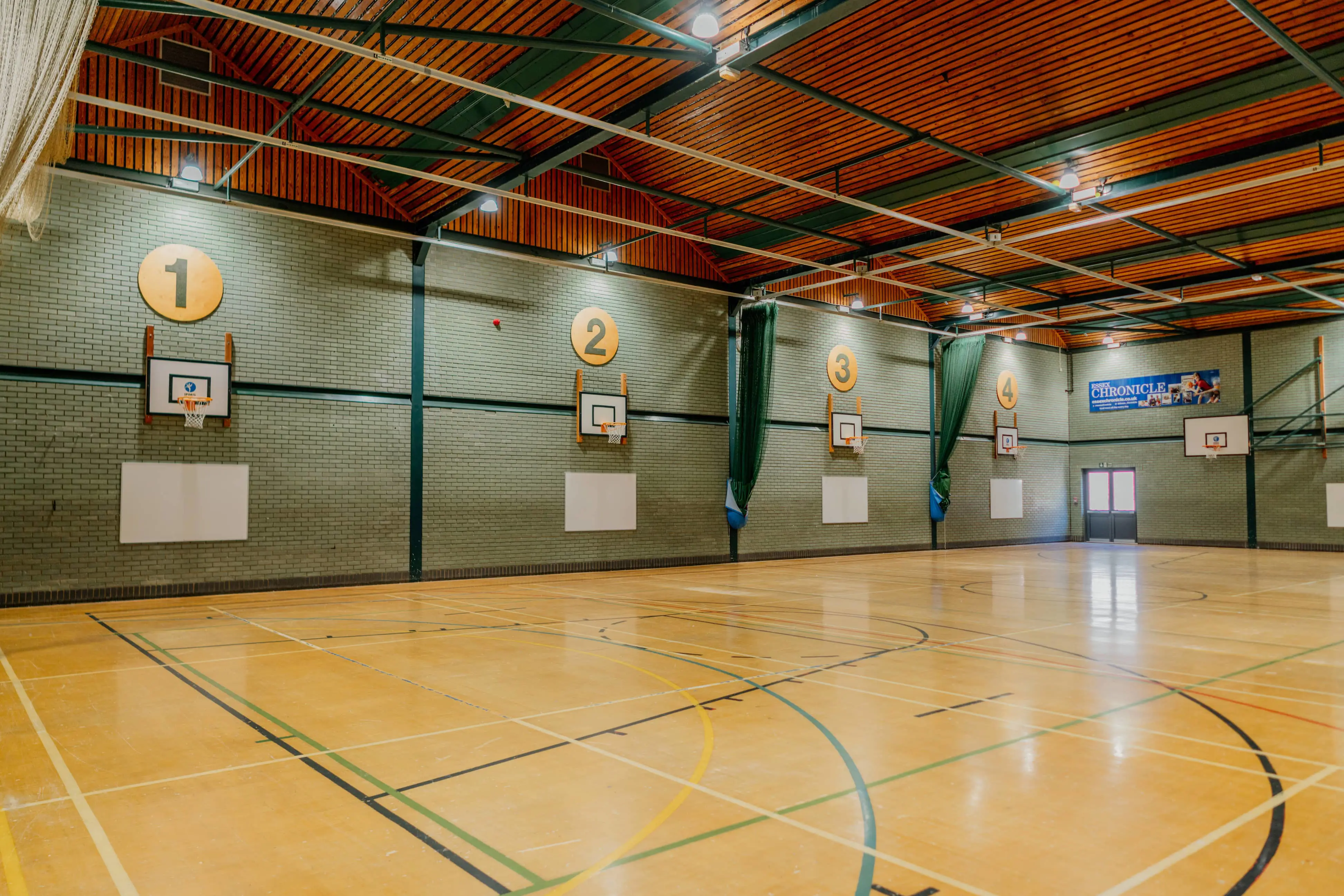 Basketball hoops around the edge of SWFLC sports hall