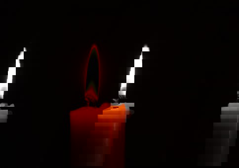 Single lit candle