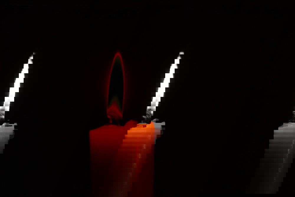 Single lit candle