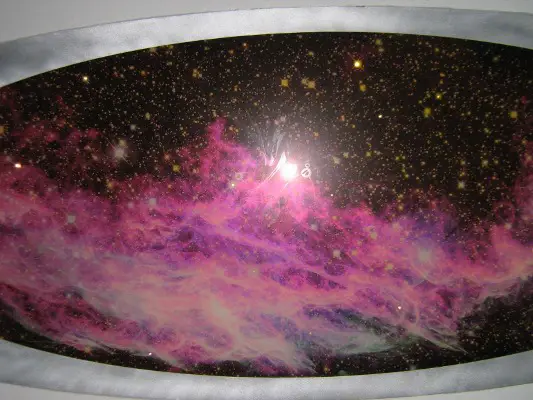 Pink celestial body floating in space