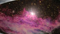 Pink celestial body floating in space preview