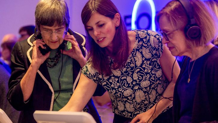 Curator Sarah Harvey demonstrates the digital exhibition on the tablet at the Forecast22 launch. 