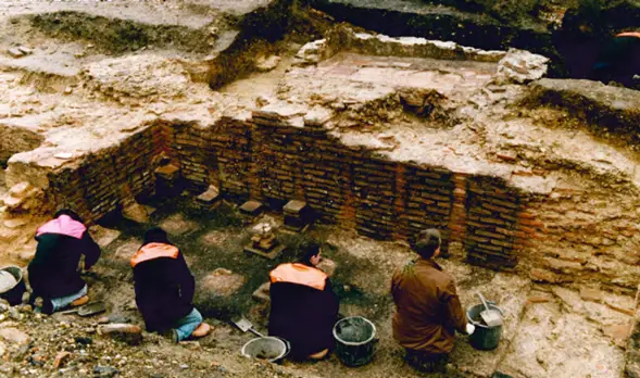 Archaeologists uncovering the heating system of the Roman baths