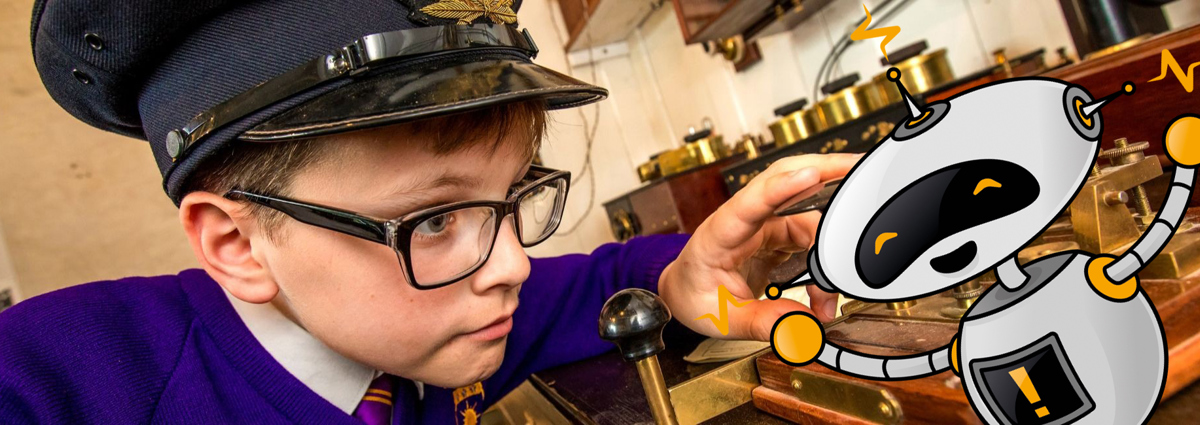 Young boy with a hat using a Morse code device. 