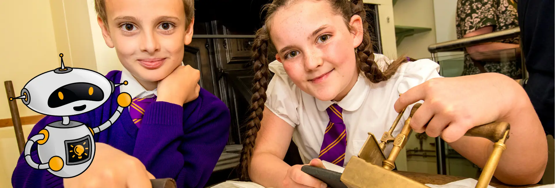 Children holding Victorian historic items and looking at camera