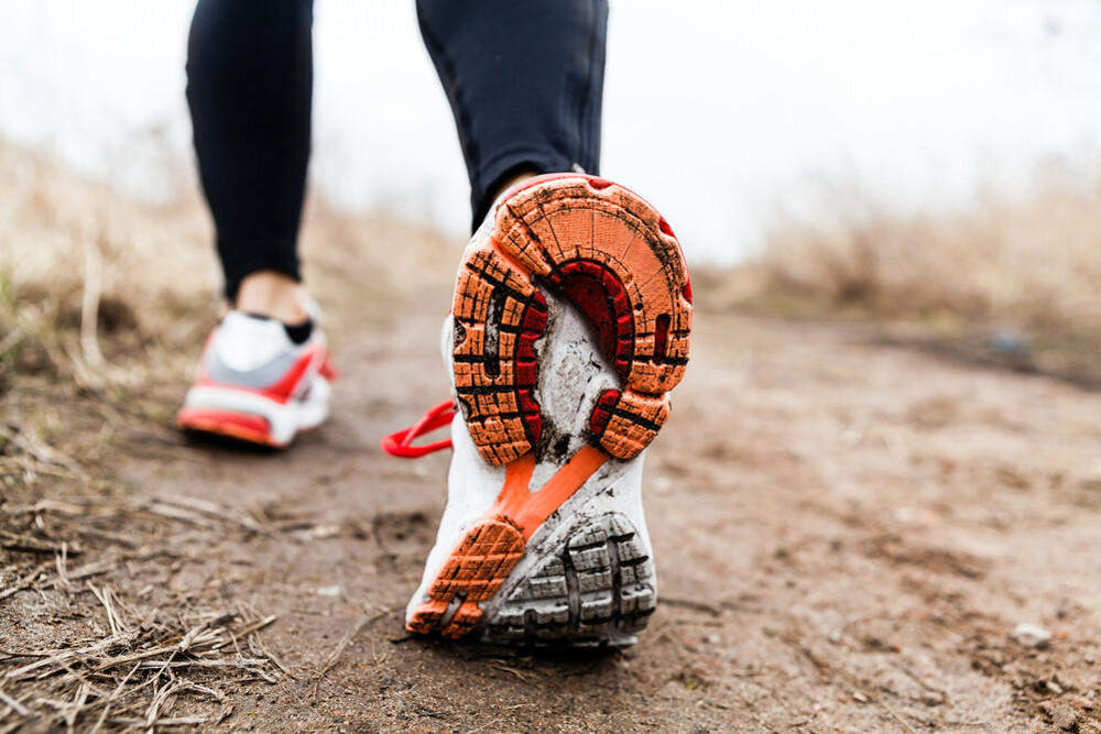 Trainers Walking Outside on muddy trail