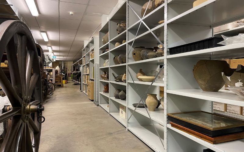 Shelves of pottery inside the Museum of Chelmsford store. 