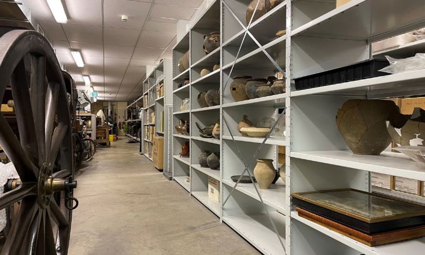 Shelves of pottery inside the Museum of Chelmsford store. 