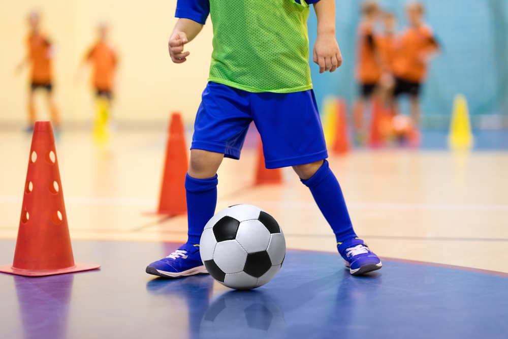 Boy practicing football skills