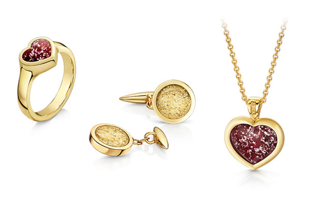 Gold ring, earrings and necklace, featuring cremated remains that look like gemstones