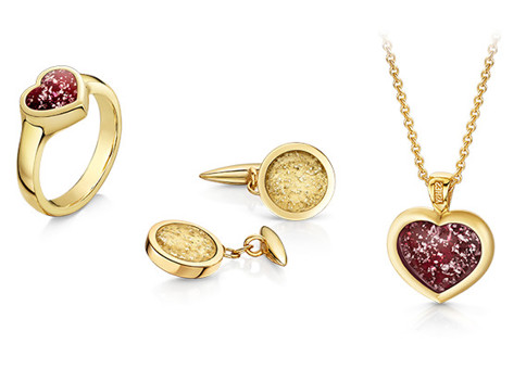 Gold ring, earrings and necklace, featuring cremated remains that look like gemstones