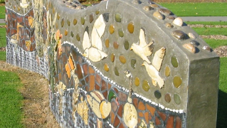 Stone wall with mosaic of local wildlife