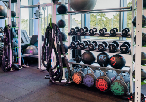 Rack full of weights and other exercise equipment at the Riverside gym