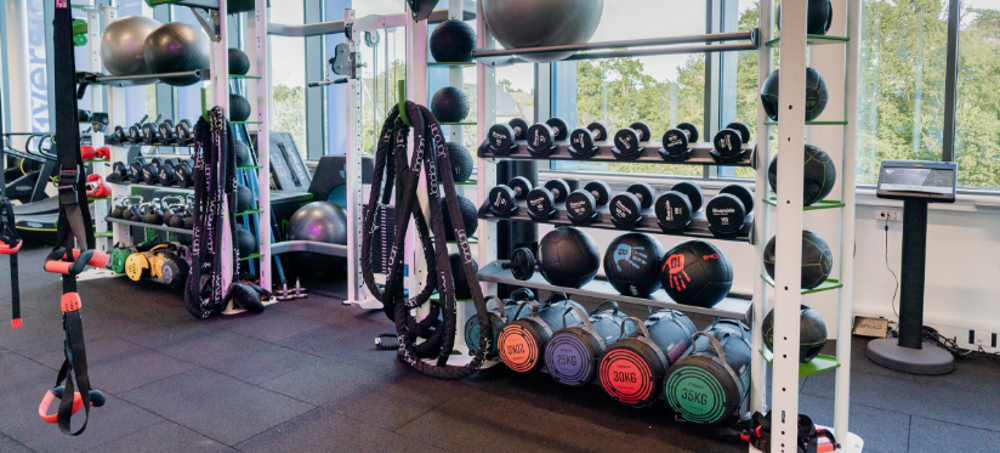 Rack full of weights and other exercise equipment at the Riverside gym