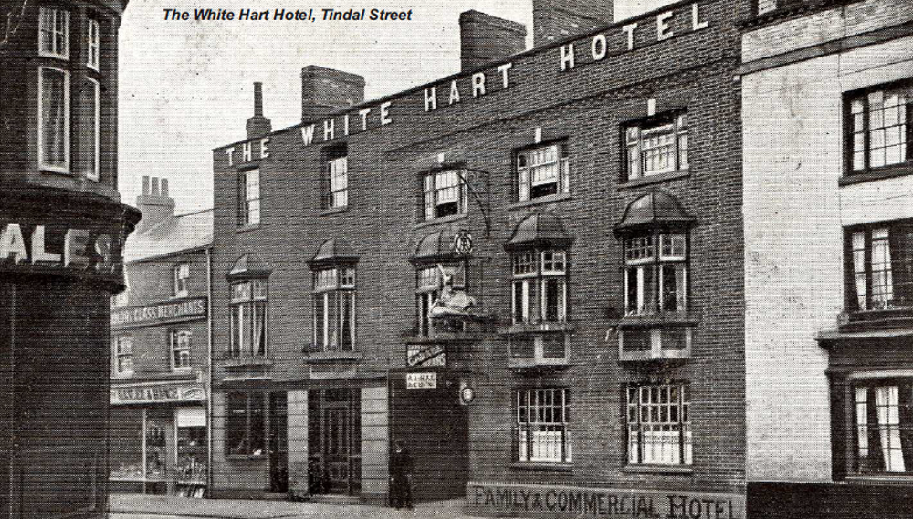 Row of shops and businesses, including The White Hart Hotel