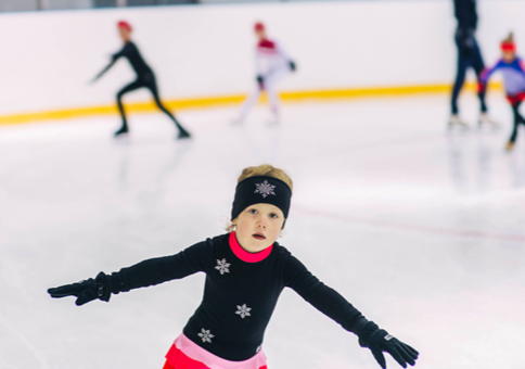 Young children ice skating