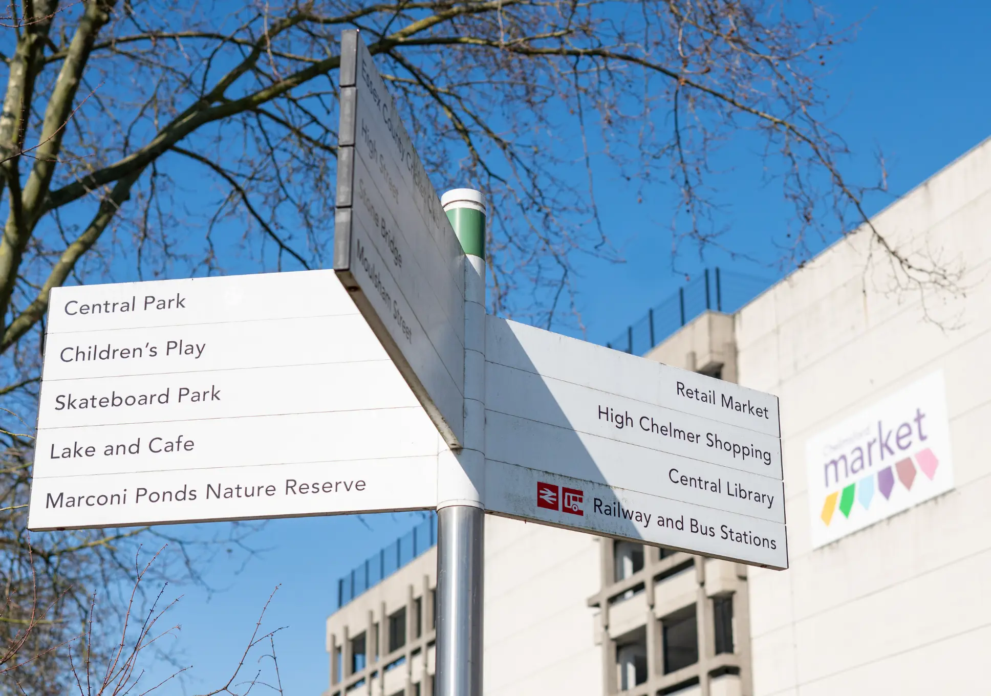 White wayfinding sign outside Chelmsford Market