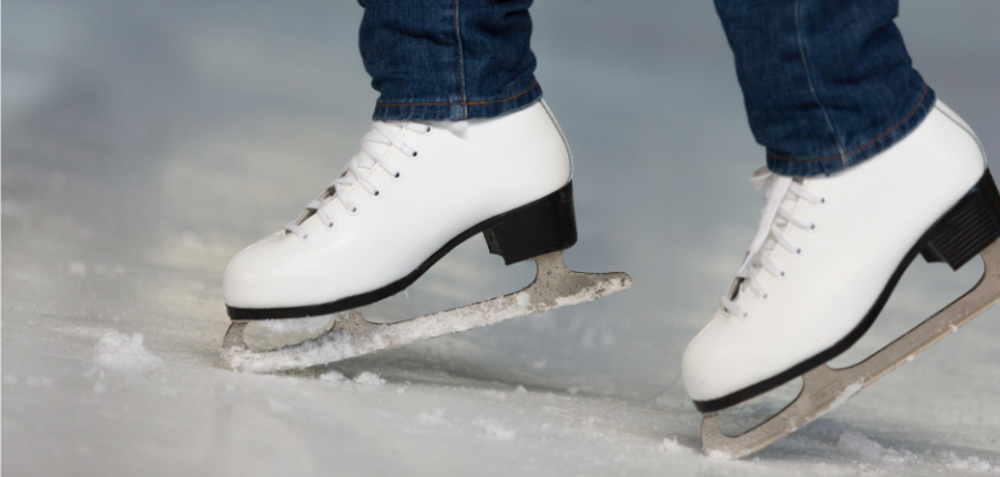 Woman wearing white ice skating boots