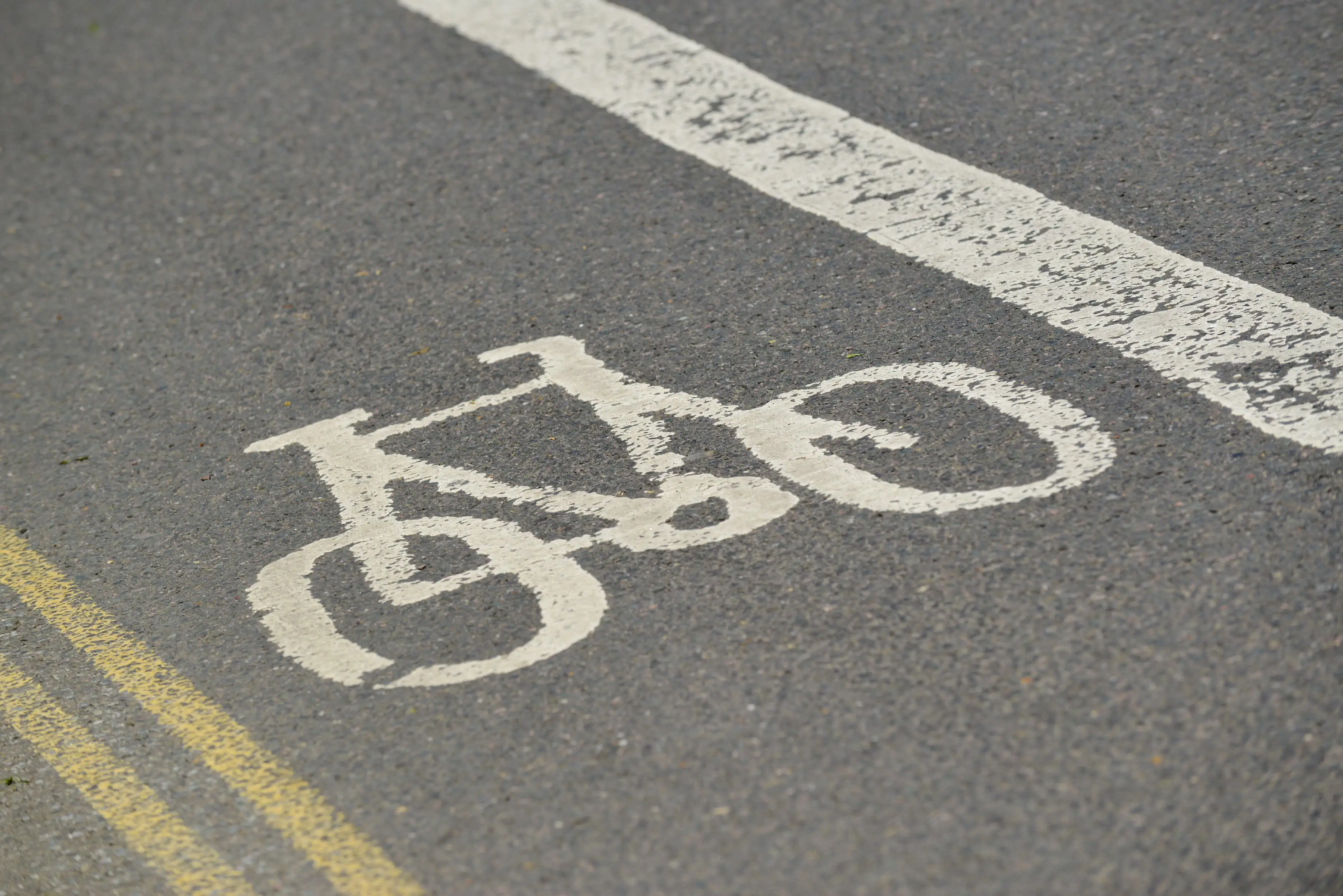 Bike logo on cycling lane in road