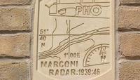 Stone plaque on a brick wall saying 'Marconi Radar: 1939:46' preview