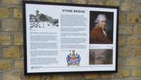Information boards for Stone Bridge and The Old County Gaol in Moulsham fixed to a brick wall preview