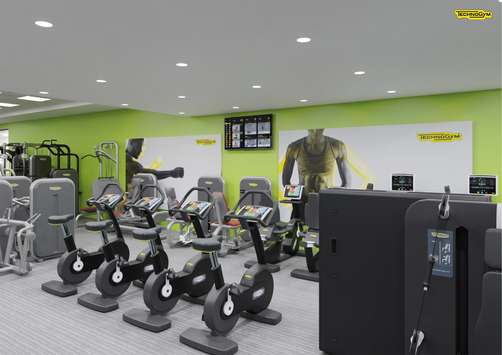 A digitally rendered image of how the CSAC gym should look once refurbished, showing two rows of various cycle machines against a light green wall and in the centre of the room, alongside various weights machines. The ceiling is dotted with downlights.