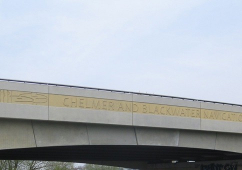 Pictures engraved on bridge with the words 'Chelmer and Blackwater Navigation'