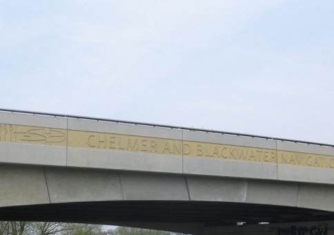 Pictures engraved on bridge with the words 'Chelmer and Blackwater Navigation'