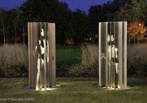 Two stainless steel figures in the grounds of ARU