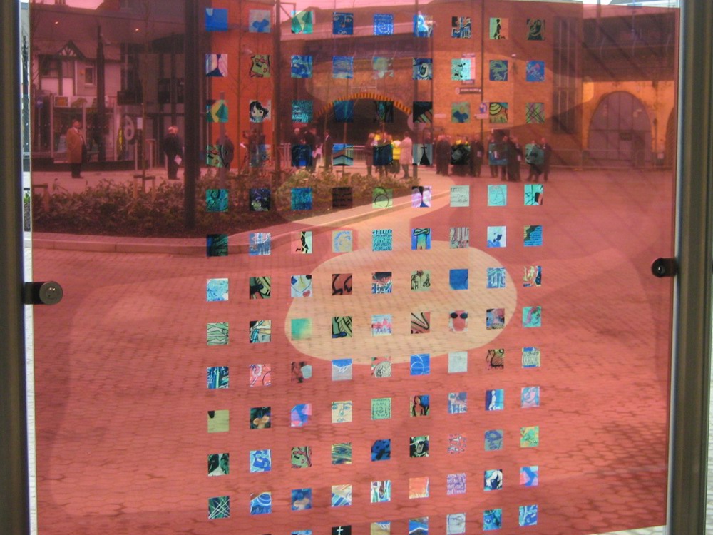 Bus concourse screen with small square pictures