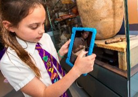 Child playing with tablet device