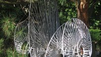 Steel sculpture in a woodland setting preview