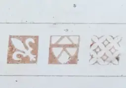 Pleshey Castle text with Fleur-de-lis and other motifs