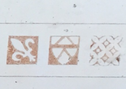 Pleshey Castle text with Fleud-de-lis and other motifs