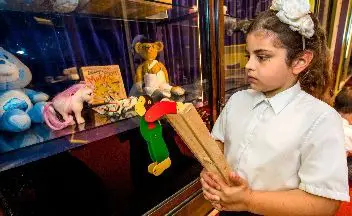 Child looking at old toys