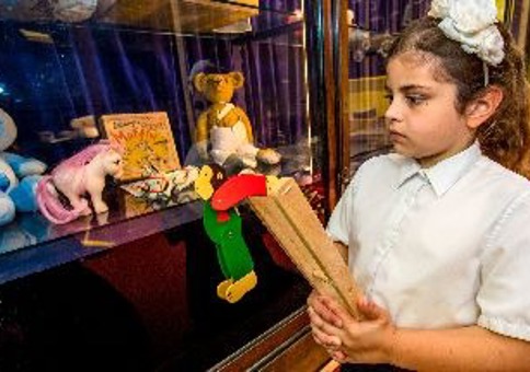 Child looking at old toys