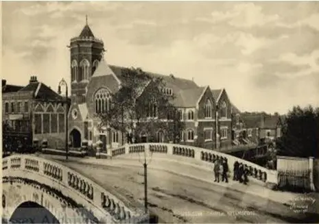 People walking over Stone Bridge (old black and white photo)