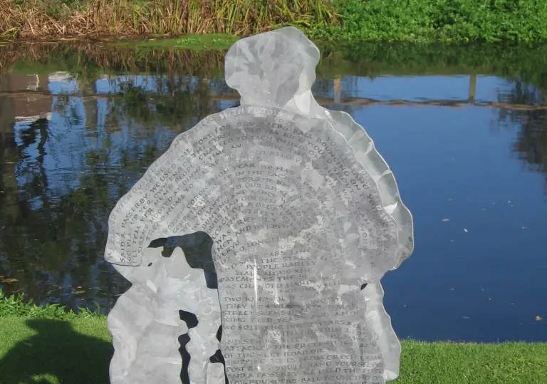 Sculpture of a man in front of river