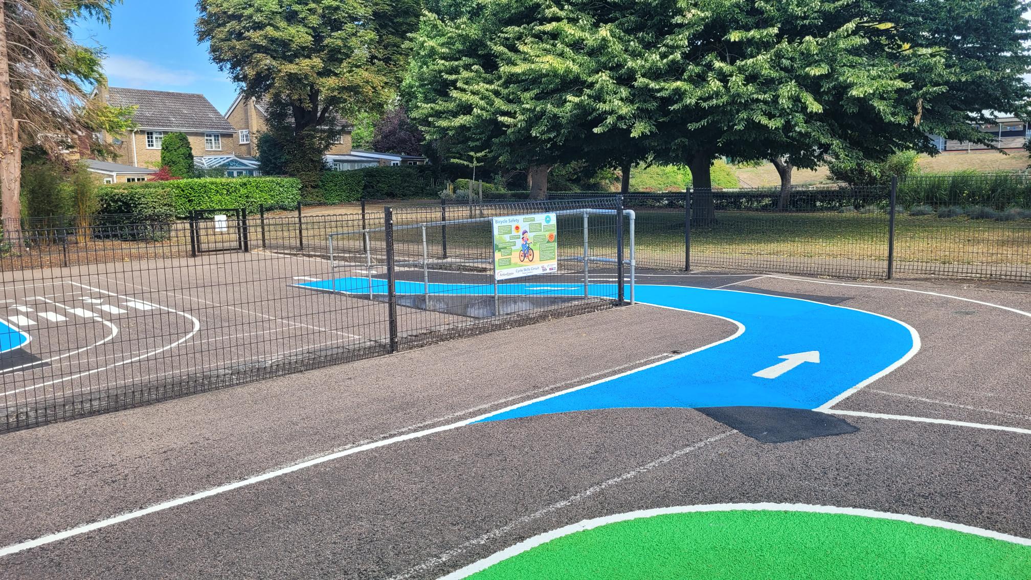 View from top of blue ramp leading from one area of the Cycle Skills Circuit to the other