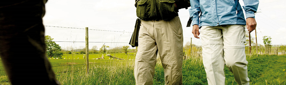 Older couple on a walk through some fields