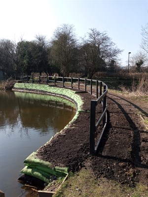 Bank of pond that has recent been reinforced