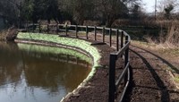 Bank of pond that has recent been reinforced preview