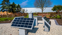 Four large stone lecterns with grid of plaques preview